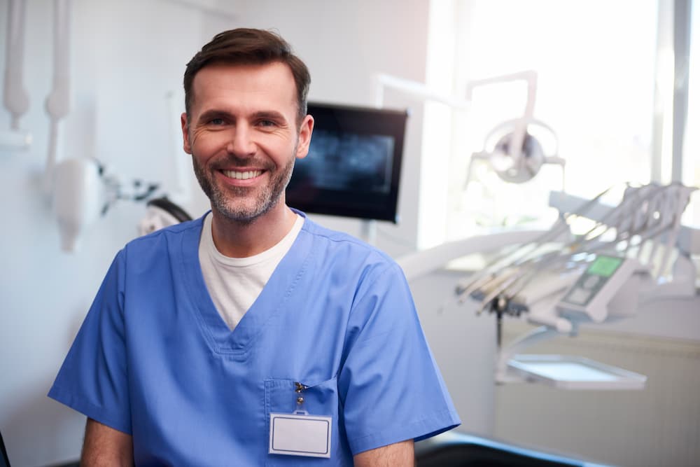 portrait-of-smiling-dentist-in-dentists-office-N2YXDVN (1)