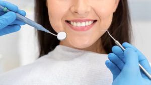 close-up-of-smiling-woman-attenting-dental-clinic-KAZFWBK (1)