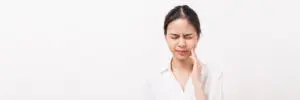 face-of-asian-woman-finger-touches-cheek-maybe-bec-2021-08-31-09-15-55-utc