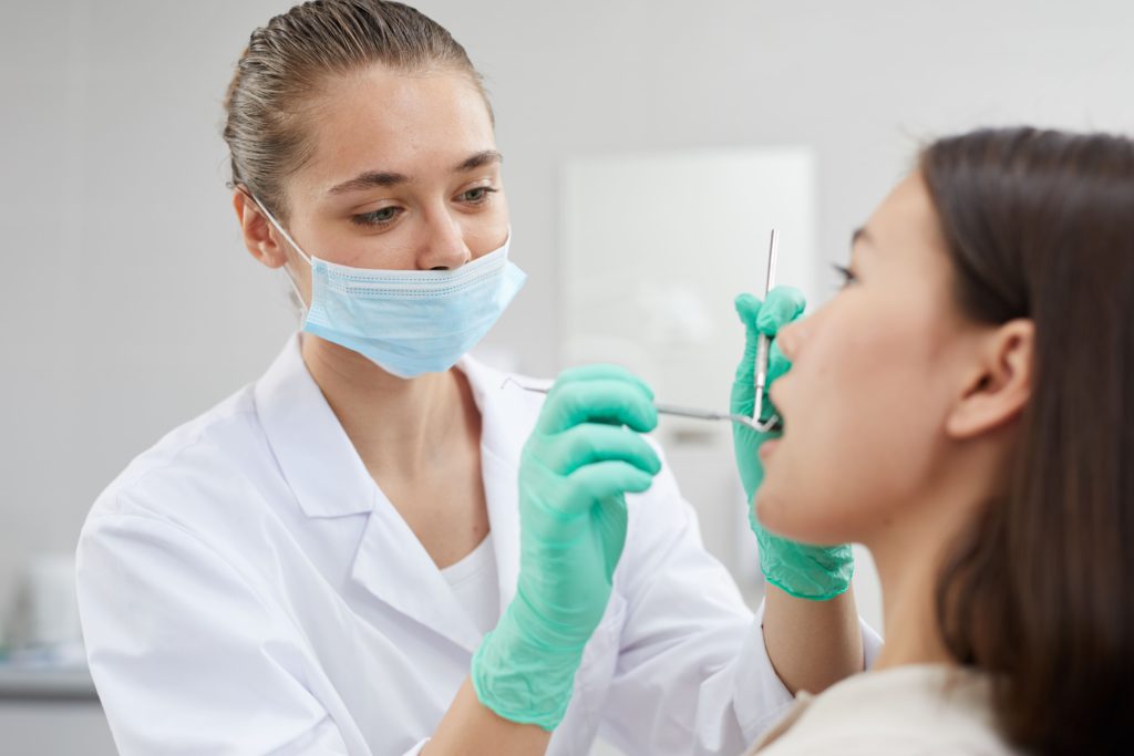dental surgeon examining patient 2021 09 24 03 58 10 utc 1