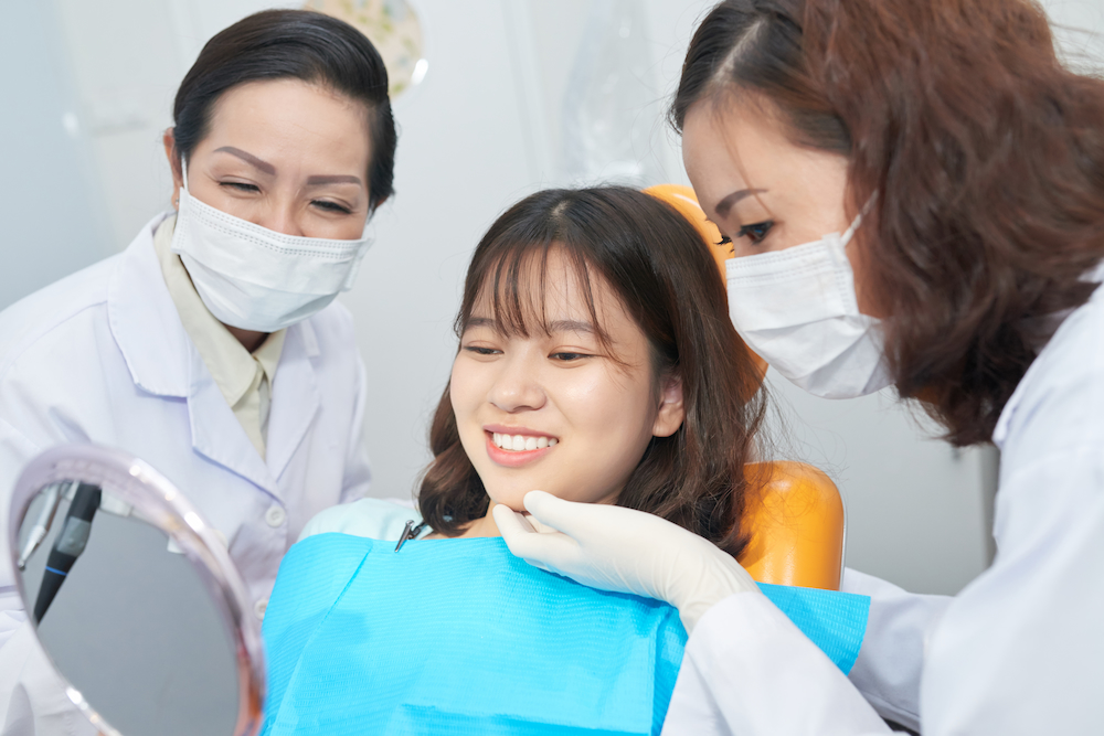 smiling teenager checking healthy teeth in dental 2021 08 26 19 52 38 utc 1