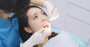 dentist examining a patient teeth in the dentist 2021 08 30 19 48 28 utc 1