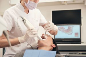 female dentist scanning teeth of woman 2022 03 04 05 56 00 utc 1 1