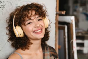 smiling young white redhead woman in headphones 2022 04 11 14 21 03 utc 1