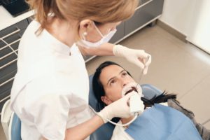 female dentist scanning teeth of woman 2022 03 04 05 56 15 utc 1