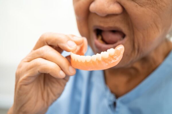 asian-elderly-woman-patient-holding-to-use-denture-2024-04-09-17-26-26-utc-1