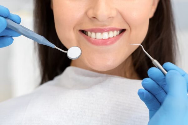 close-up-of-smiling-woman-attenting-dental-clinic-KAZFWBK (1)