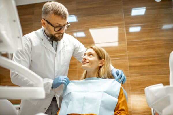 dentist-with-patient-at-the-dental-office-2022-01-18-23-45-38-utc