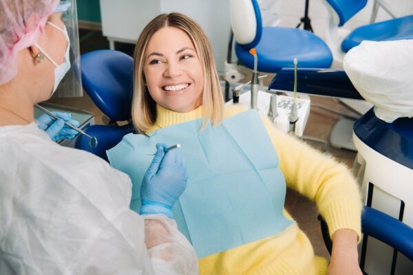 the-girl-smiles-at-the-dentist-and-looks-at-her-2021-12-13-19-35-06-utc (1)